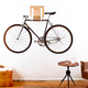 Illustration for article titled A Wall-Mounted Bike Rack Turns Your Ride Into Art
